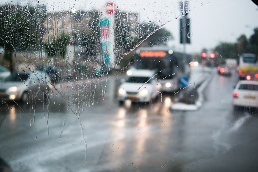 white suv on road during rain