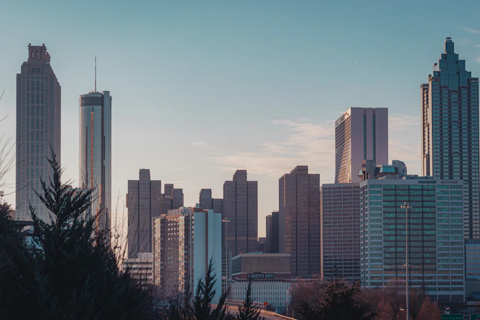 Grey office towers of the Atlanta skyline under a blue sky, the capital of the US state of Georgia