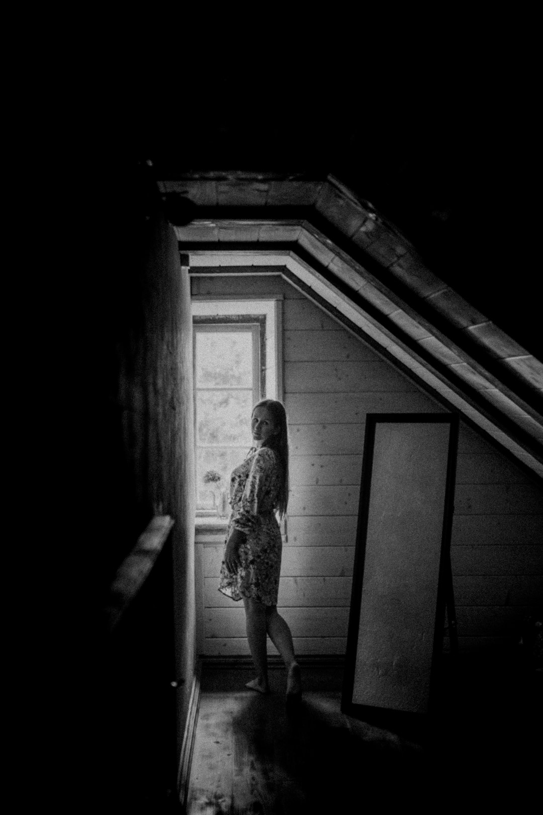 woman in dress standing on door