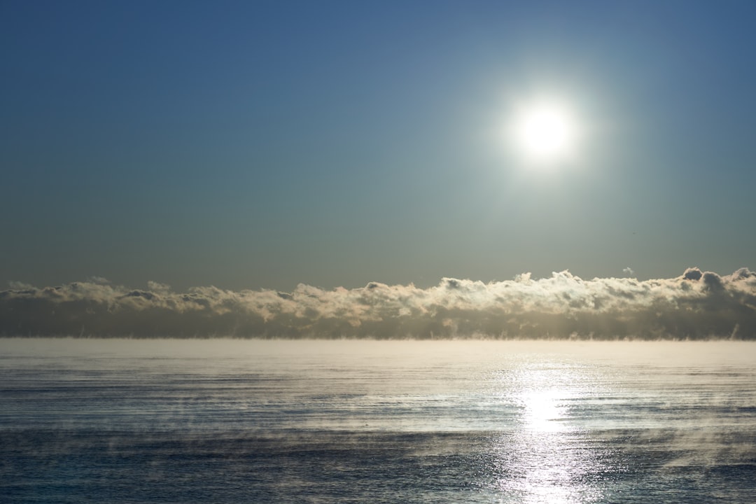 body of water under blue sky during daytime