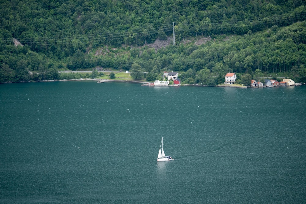 white sailboat on sea during daytime