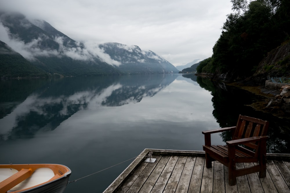 brown wooden dock on lake during daytime