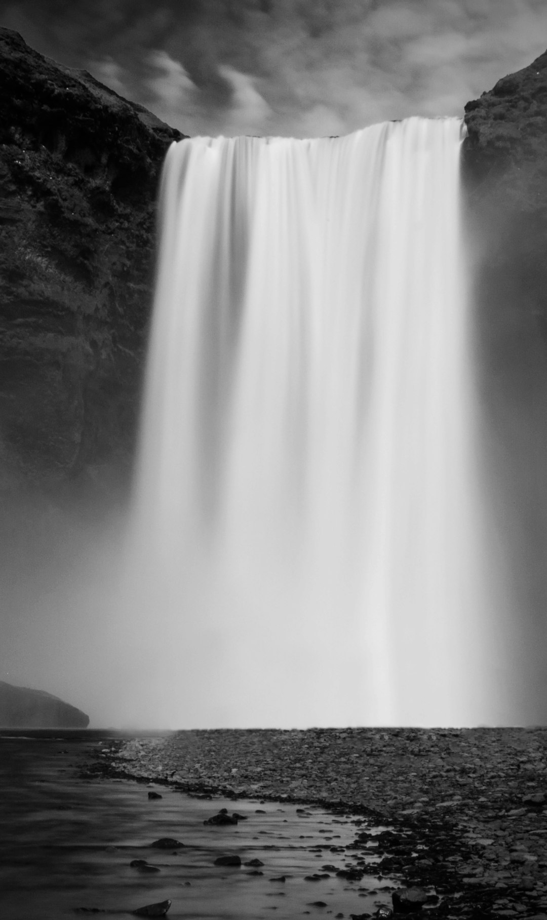grayscale photo of waterfalls during daytime