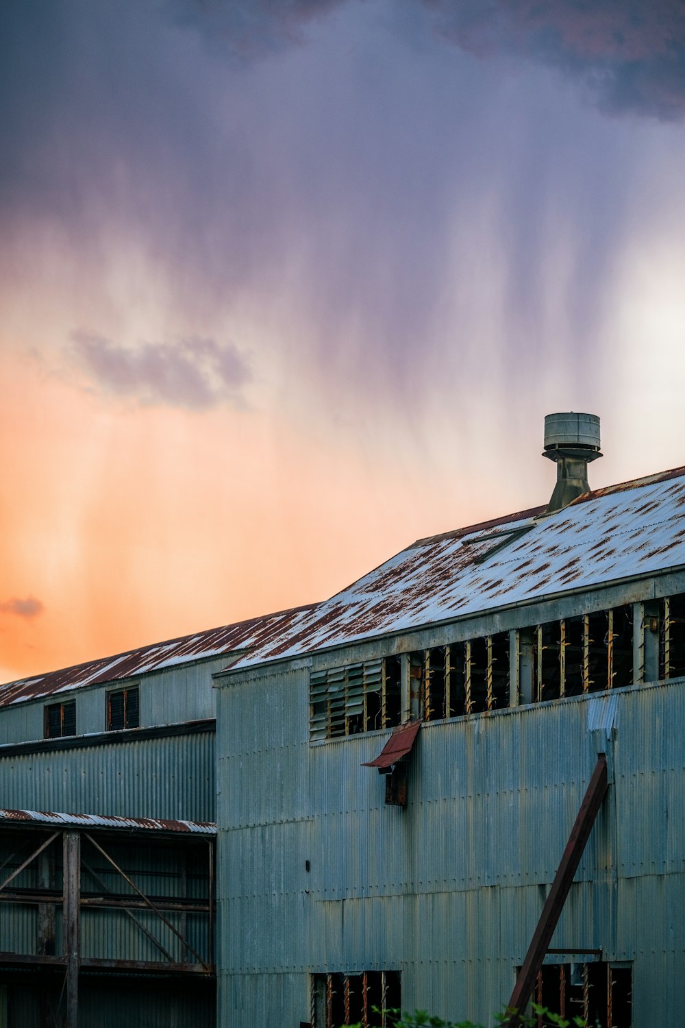 gray wooden house under white clouds