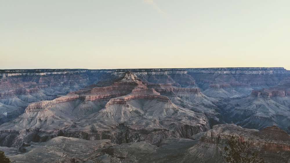 brown rocky mountain under blue sky during daytime