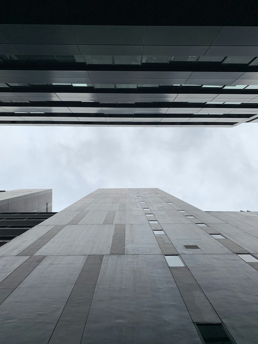 low angle photography of gray concrete building