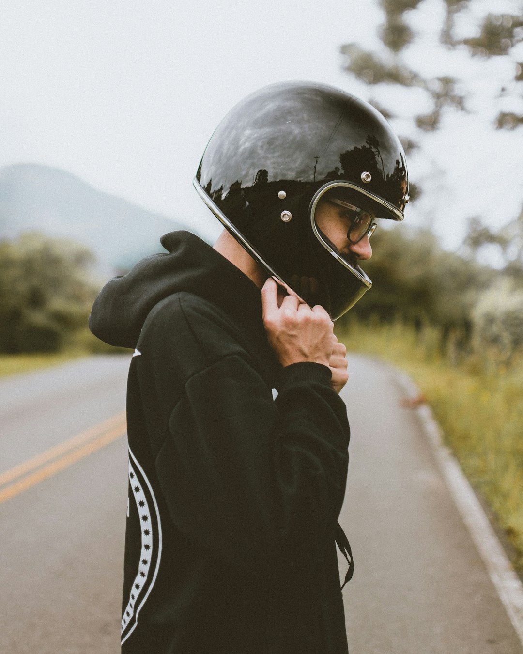 man in black jacket wearing black helmet