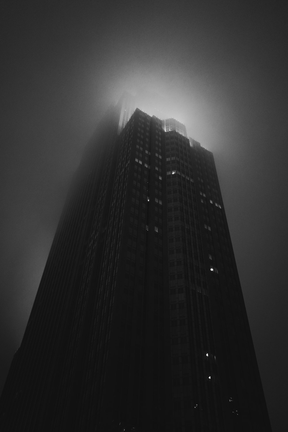 grayscale photo of high rise building