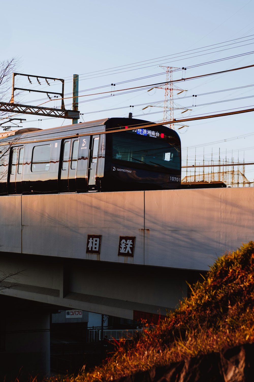 brown and white train under blue sky during daytime