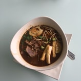 A steaming bowl of traditional Tibetan noodle soup.