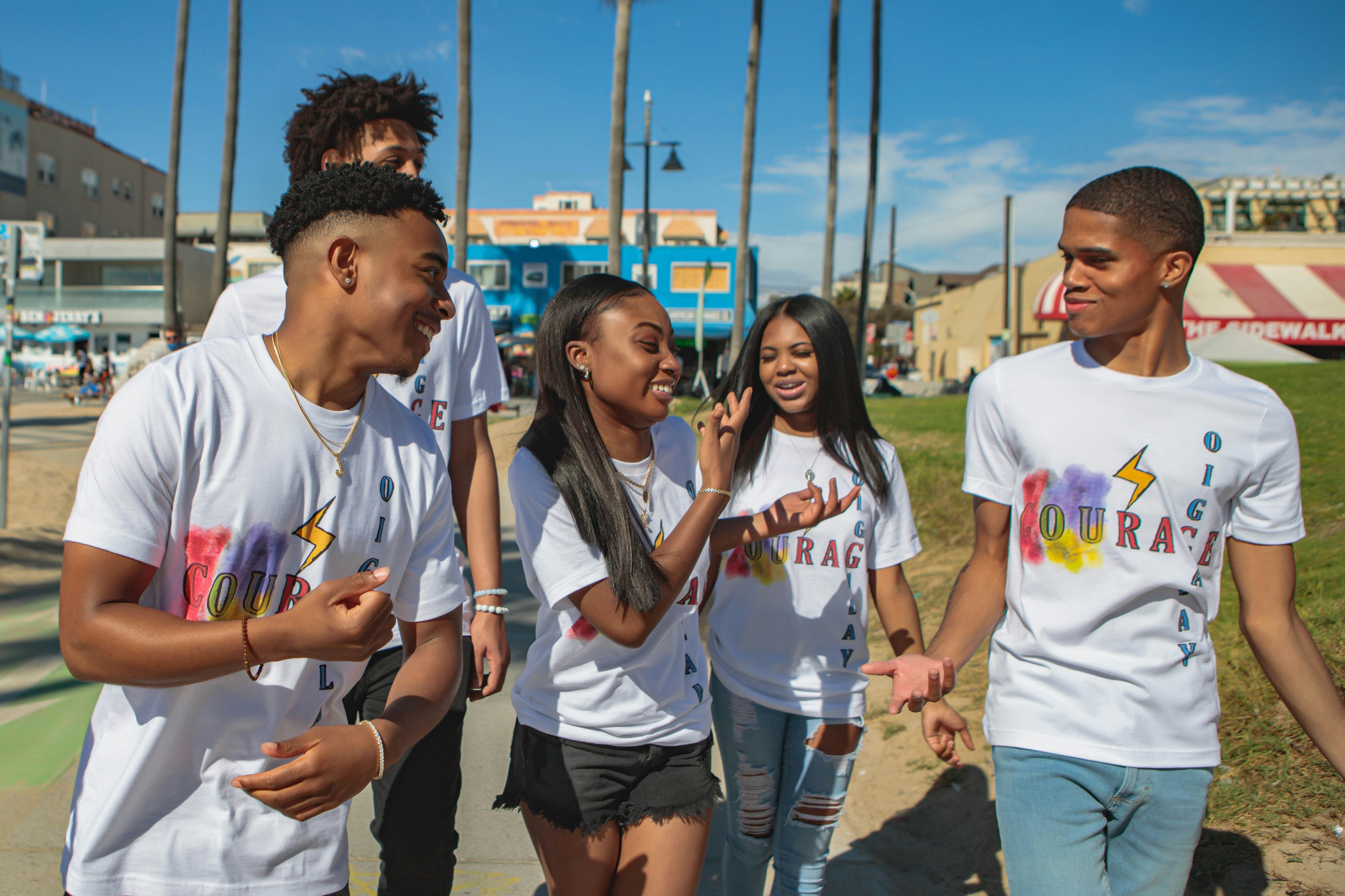 young people talking on the street at Venice Beach