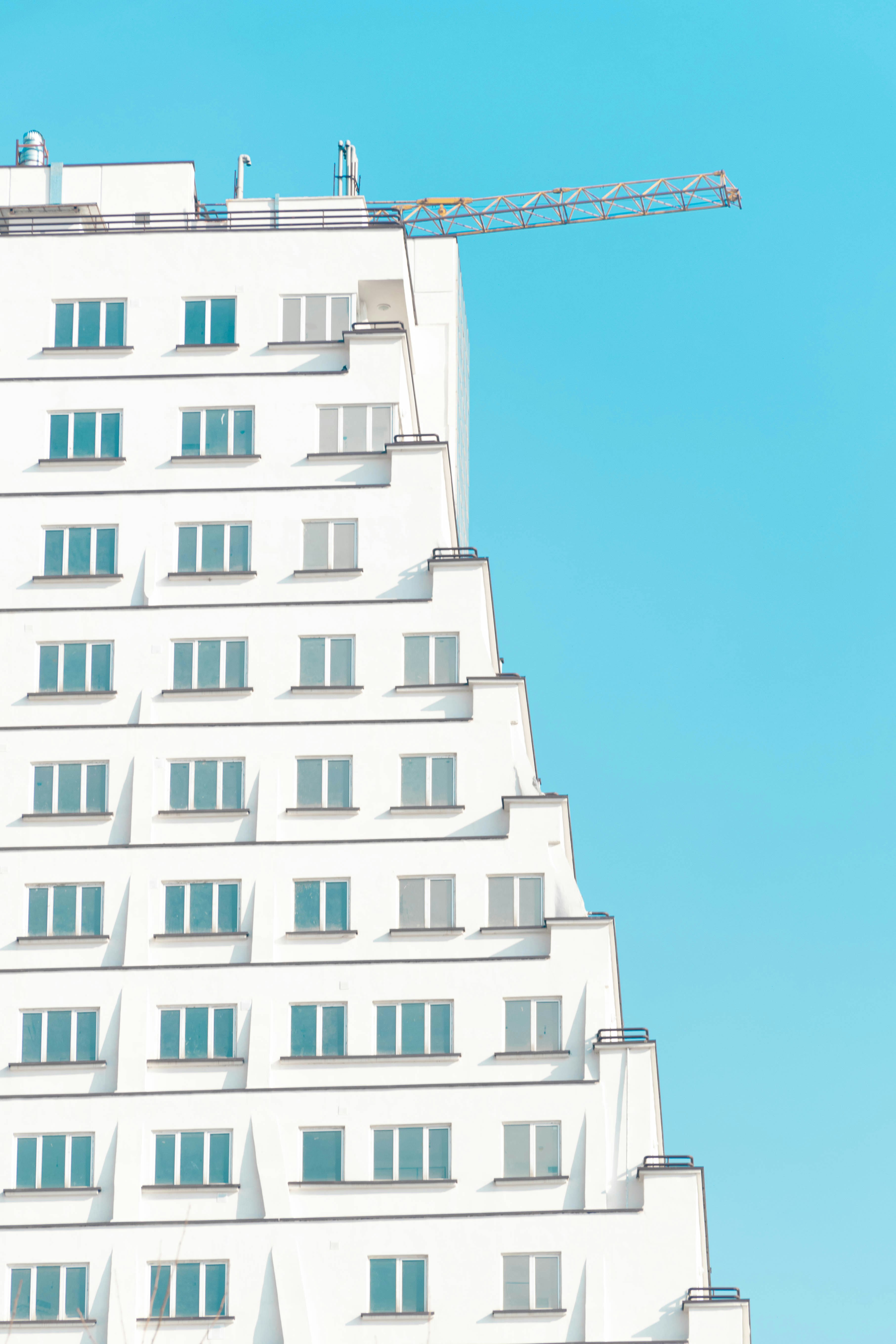 white concrete building under blue sky during daytime