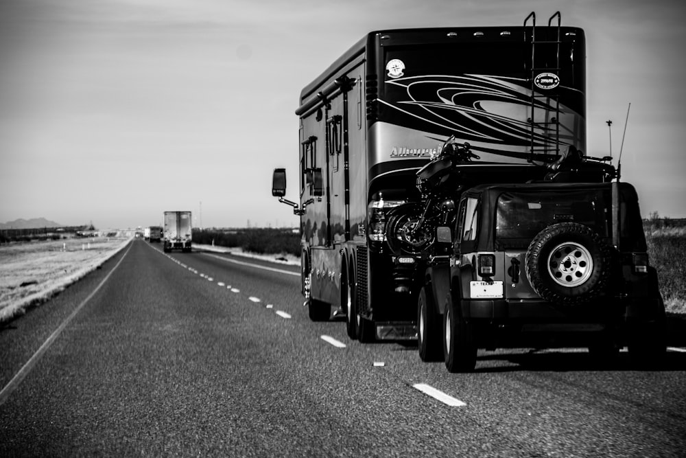 black and white truck on road during daytime