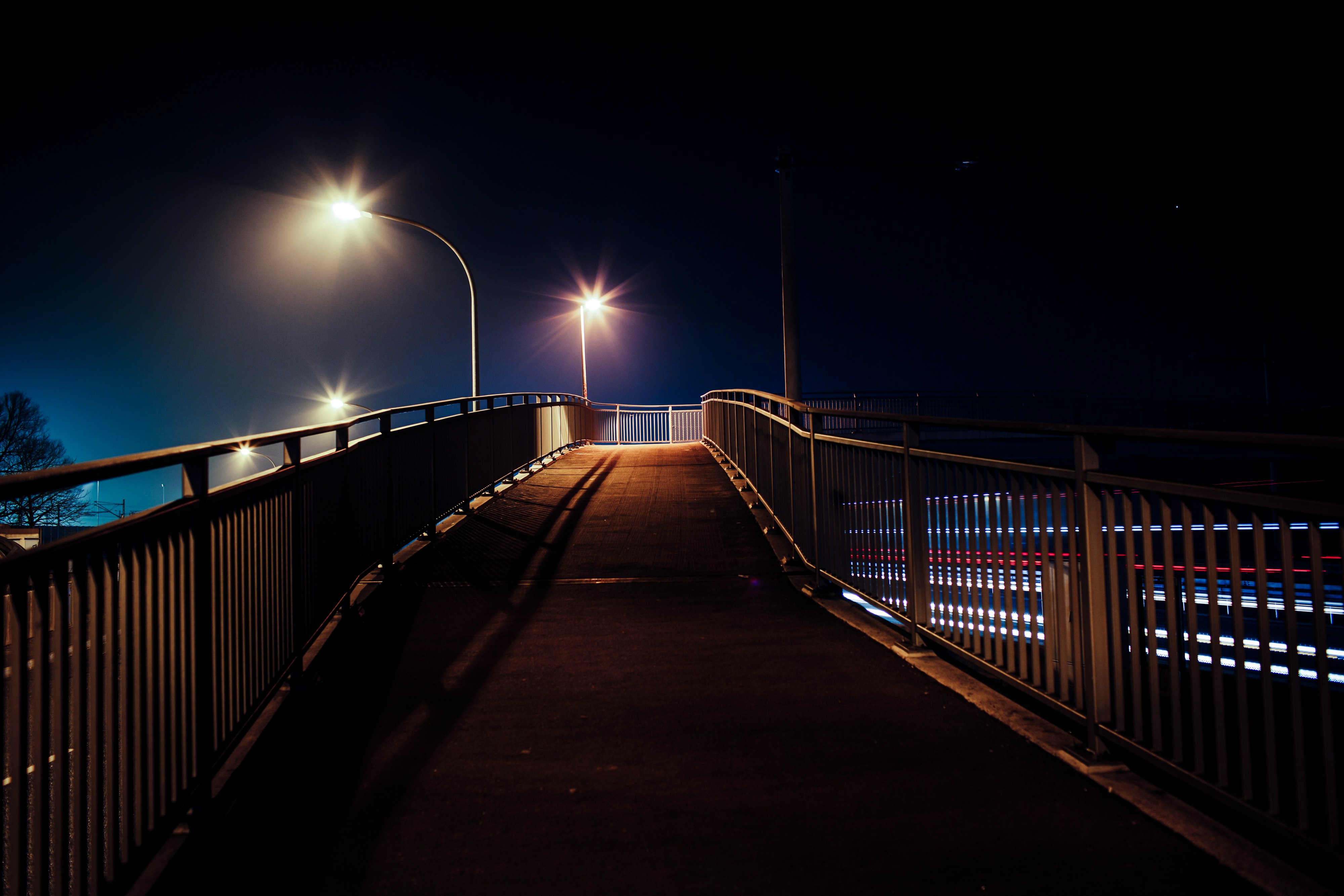 brown wooden bridge during night time