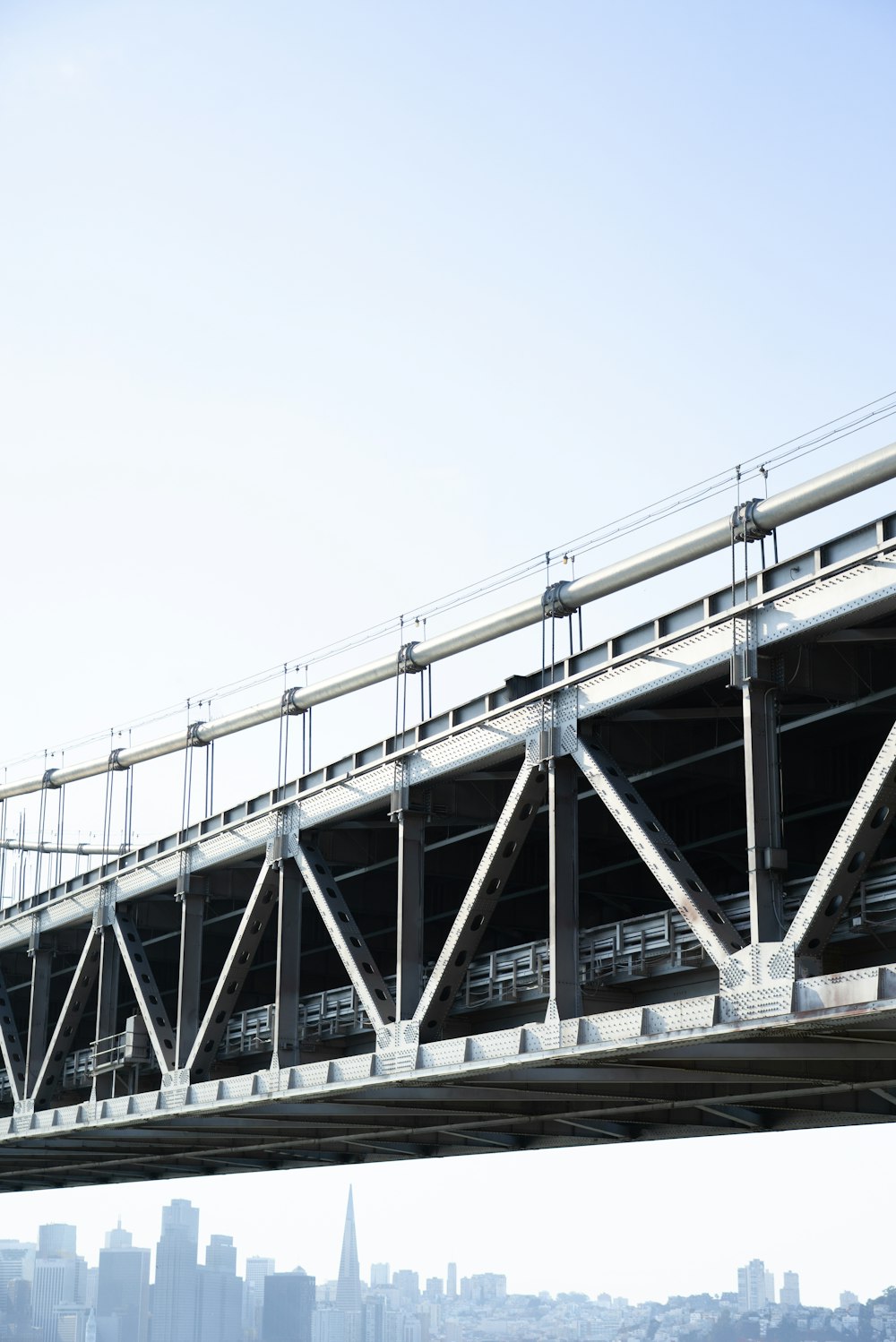 white and gray bridge under blue sky during daytime