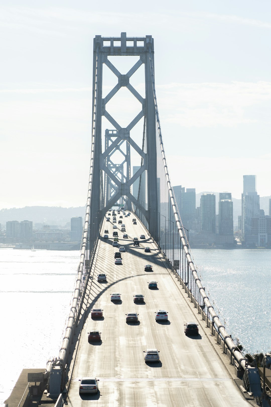 gray concrete bridge over body of water during daytime