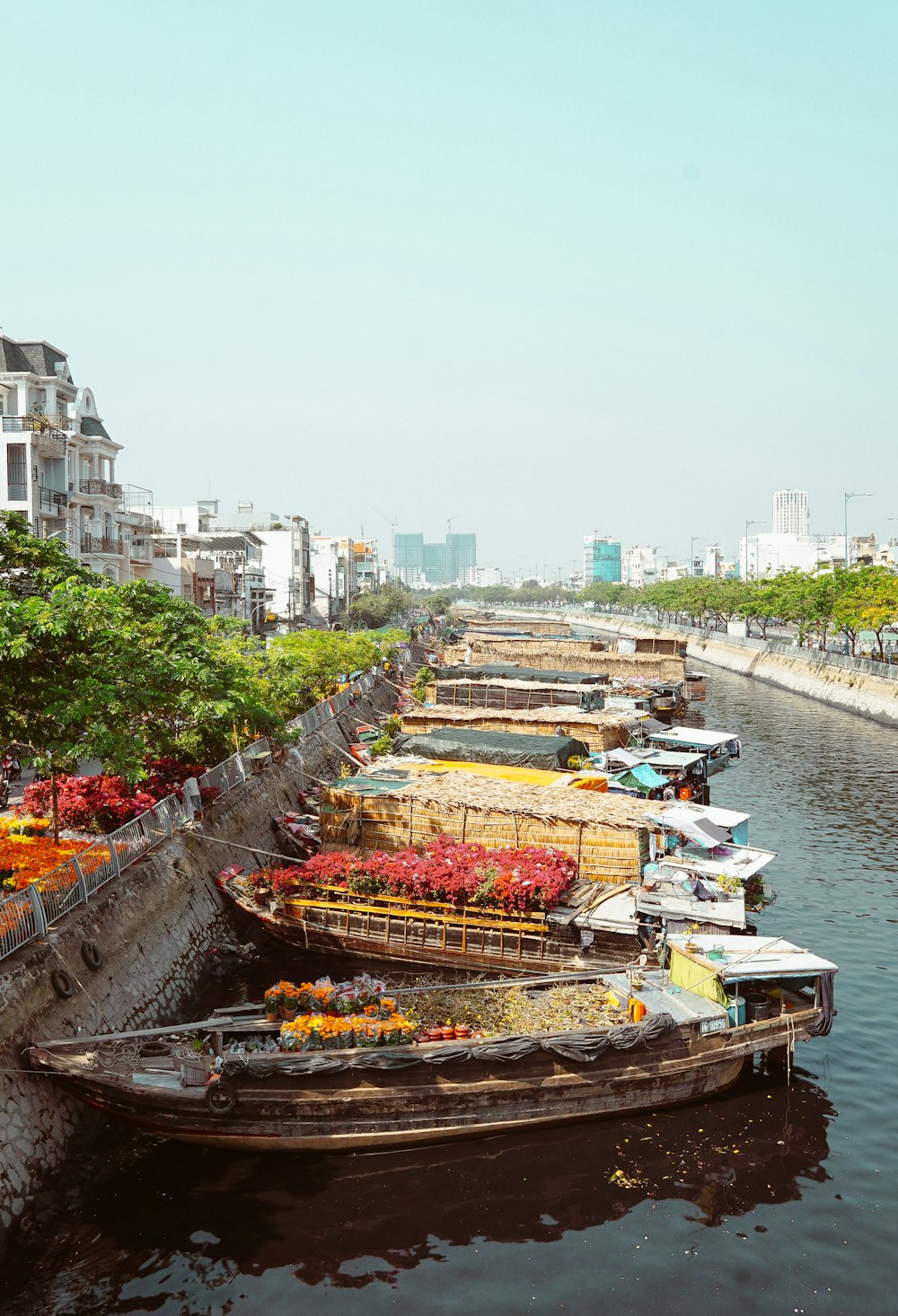 boat on river near buildings during daytime