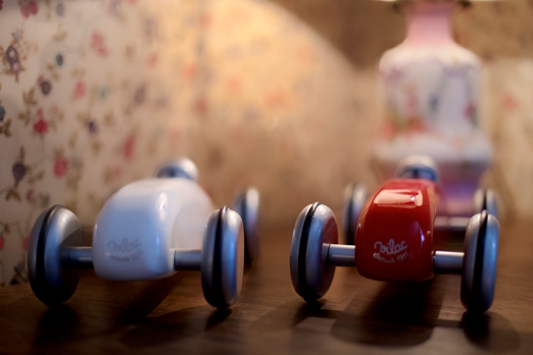 blue and red dumbbells on brown wooden table