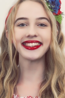 Smiling customer wearing LEGO hair pins and a matching necklace at a convention.