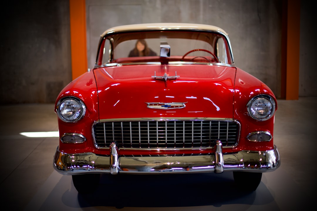 red classic car in a room