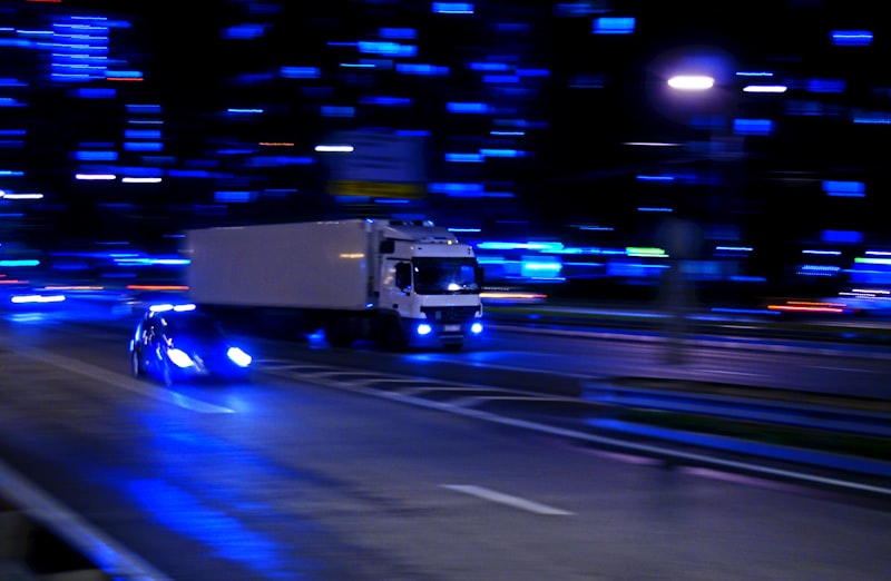 white and black bus on road during night time