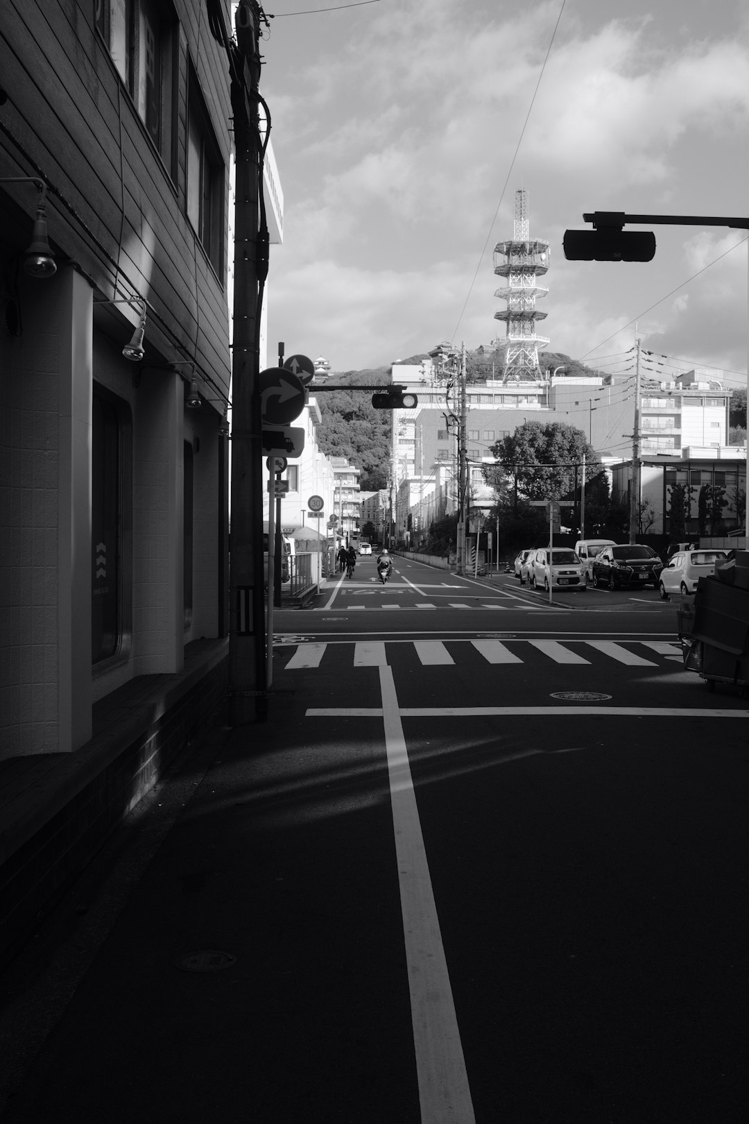 grayscale photo of cars on road