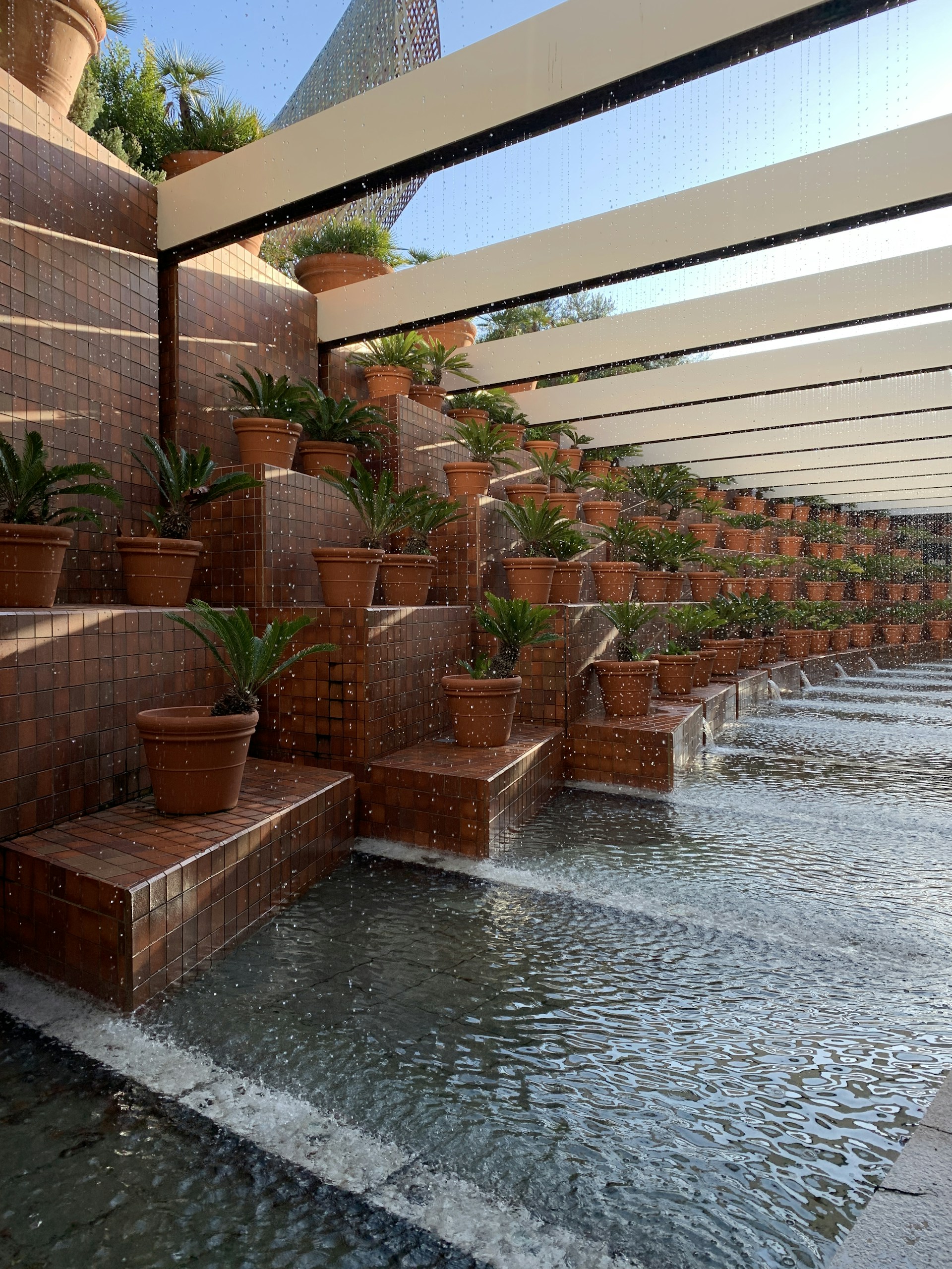 woman wearing yellow long-sleeved dress under white clouds and blue sky during daytime