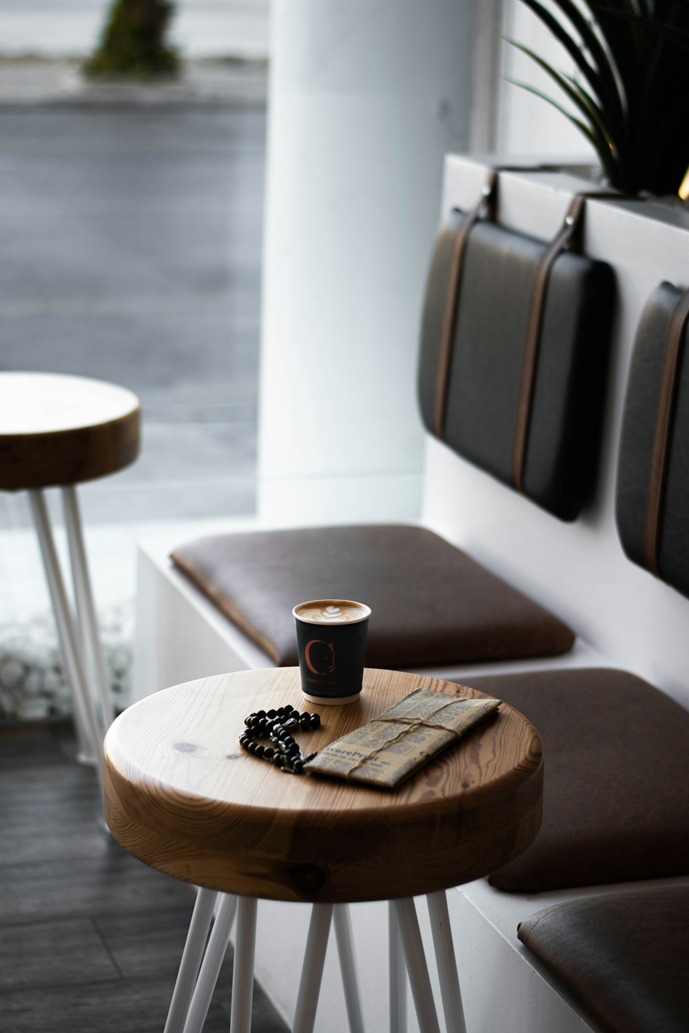 black and white ceramic mug on brown wooden table