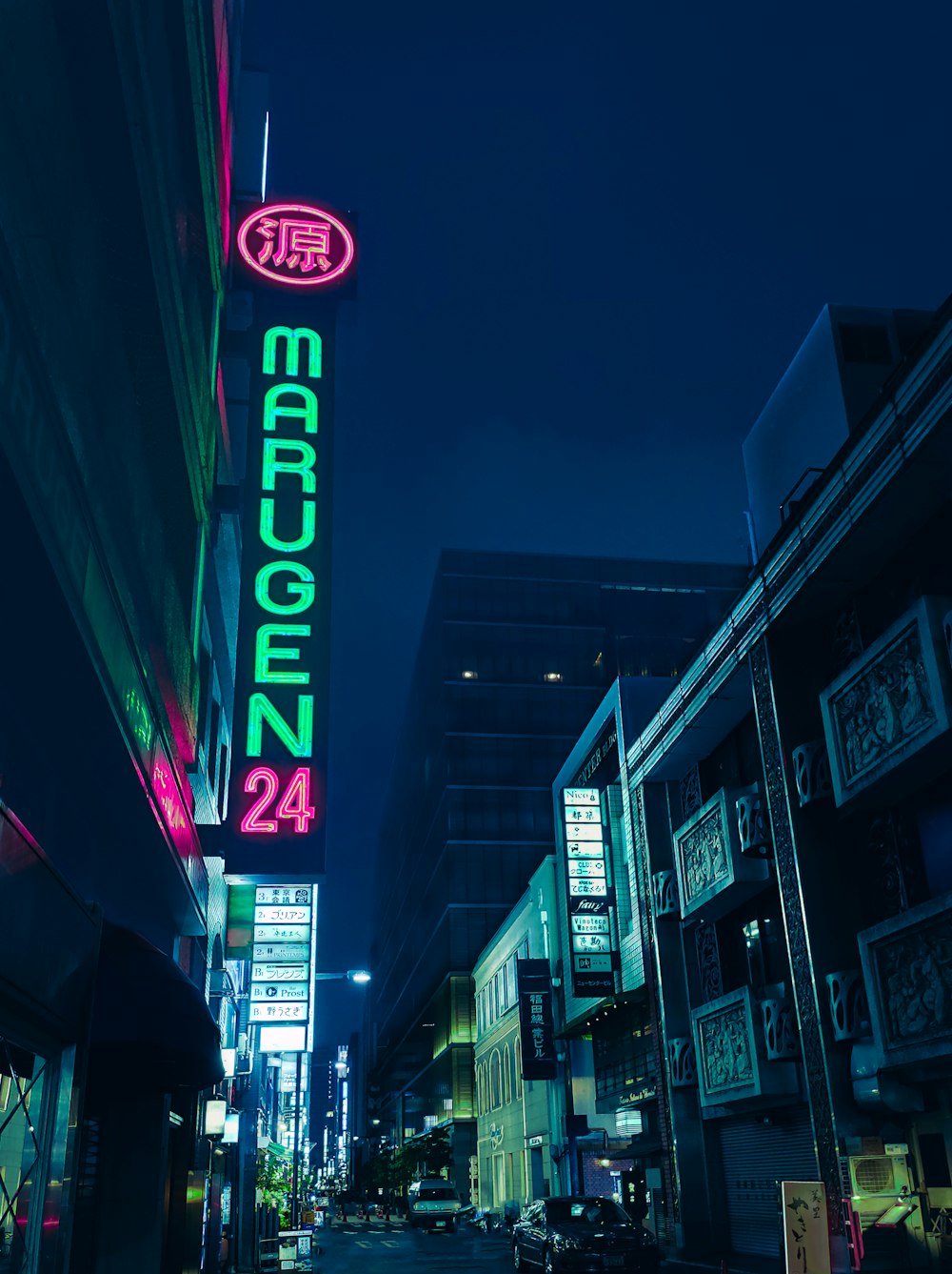 low light photography of high rise building during night time