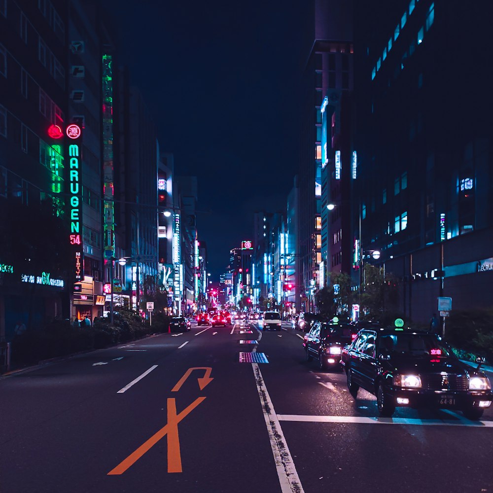 cars on road in city during night time