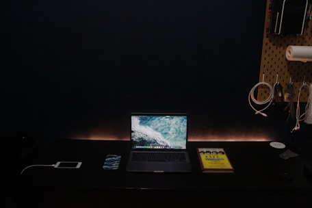 Calm workspace featuring warm sand tones and a minimalist setup with a tactile feedback device.