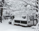 A trailer parked in winter, its diesel heater quietly running to keep frost at bay.