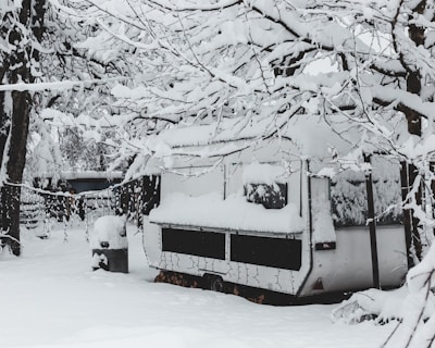 A trailer parked in winter, its diesel heater quietly running to keep frost at bay.