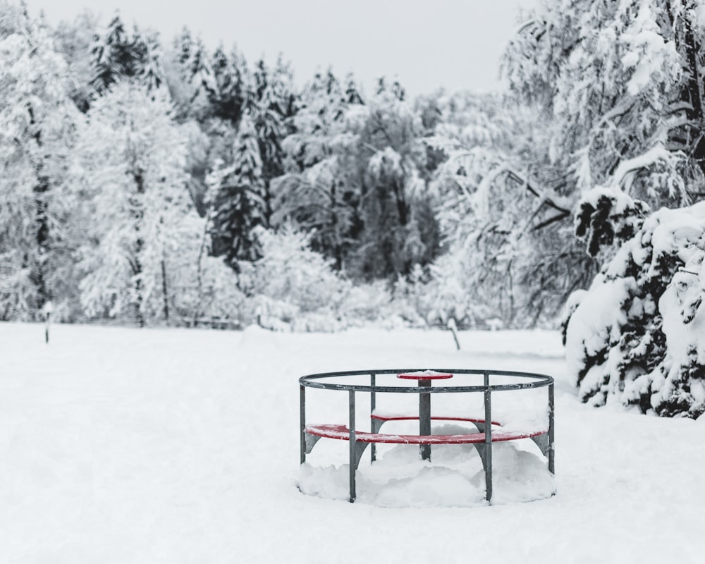 red metal frame on snow covered ground