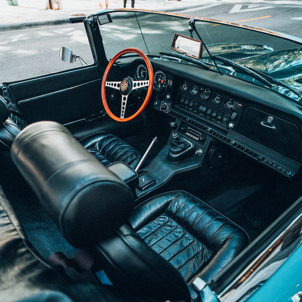 black and red car steering wheel