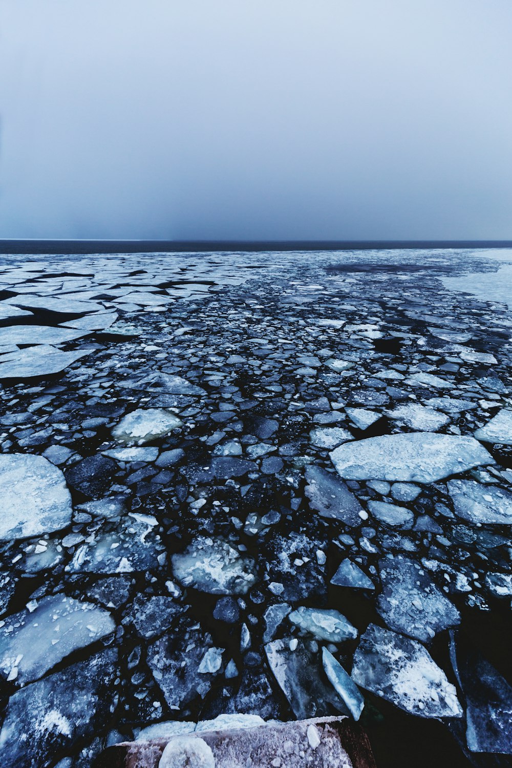 gray and black stones on body of water