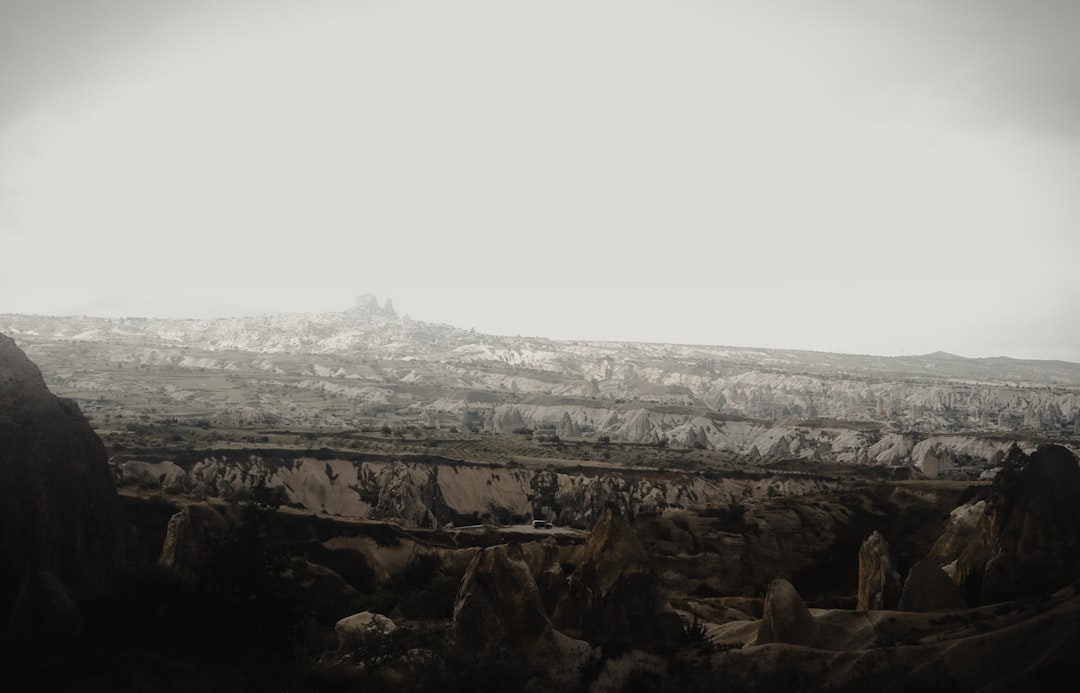 brown rocky mountain under white sky during daytime