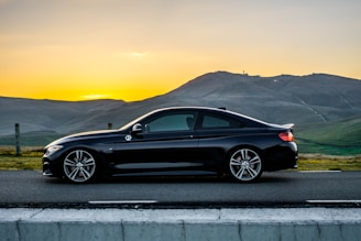 black bmw m 3 coupe on road during daytime