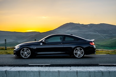 black bmw m 3 coupe on road during daytime