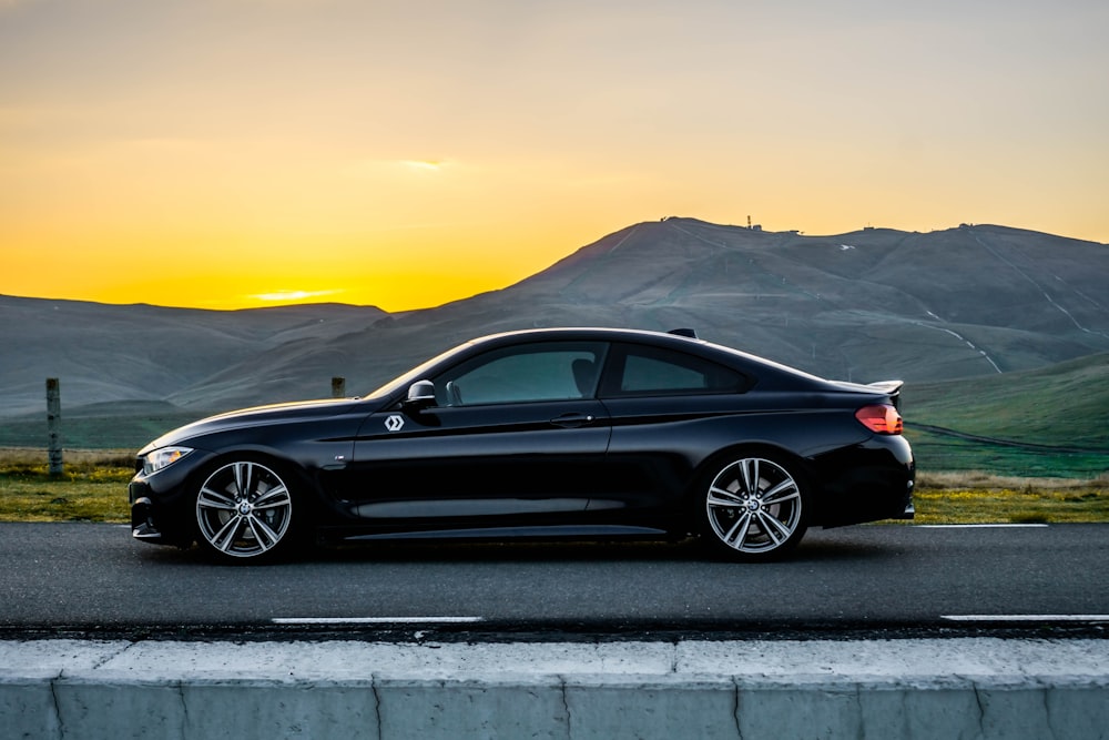 black bmw m 3 coupe on road during daytime