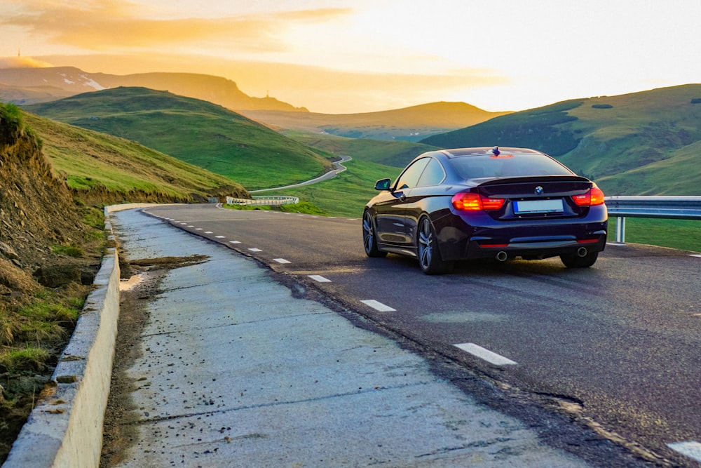 black car on road during daytime