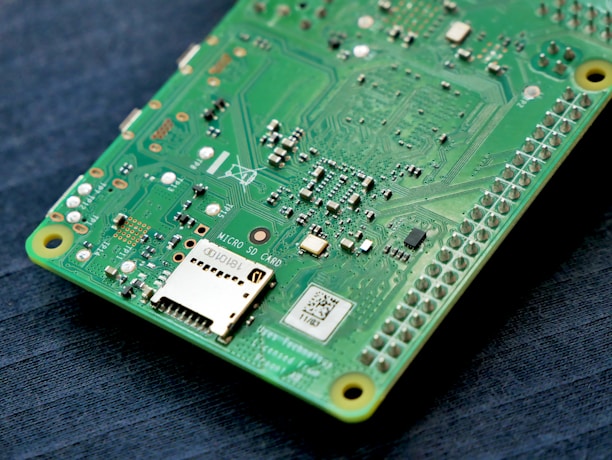 green and black embedded circuit board with microSD card socket