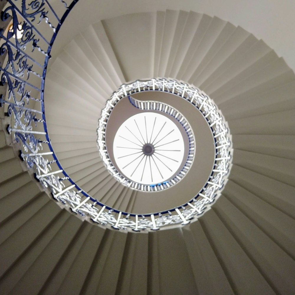 white spiral staircase with white metal railings