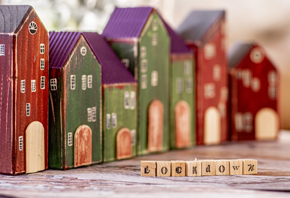 red green and brown boxes on wooden floor