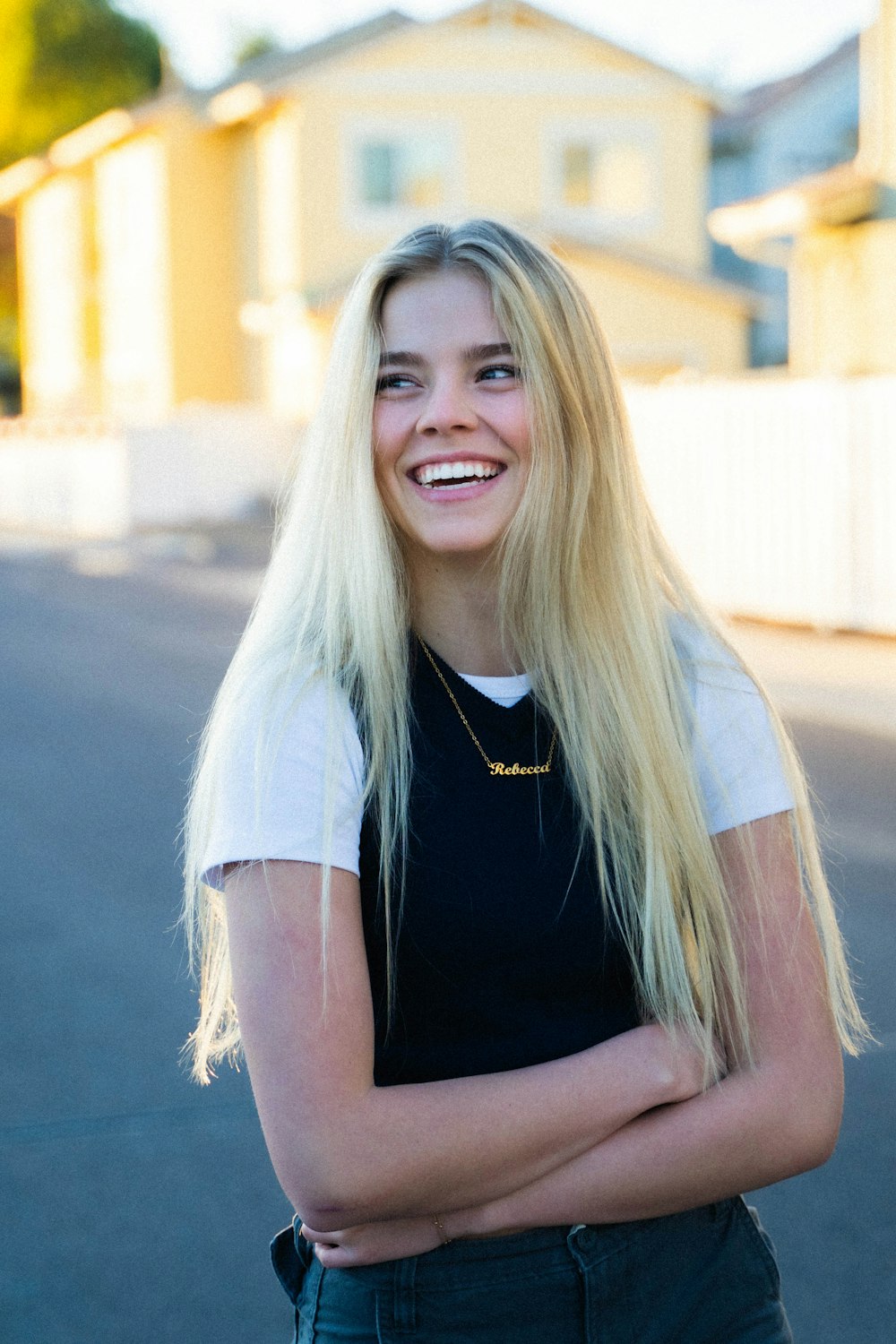 woman in black sleeveless shirt smiling