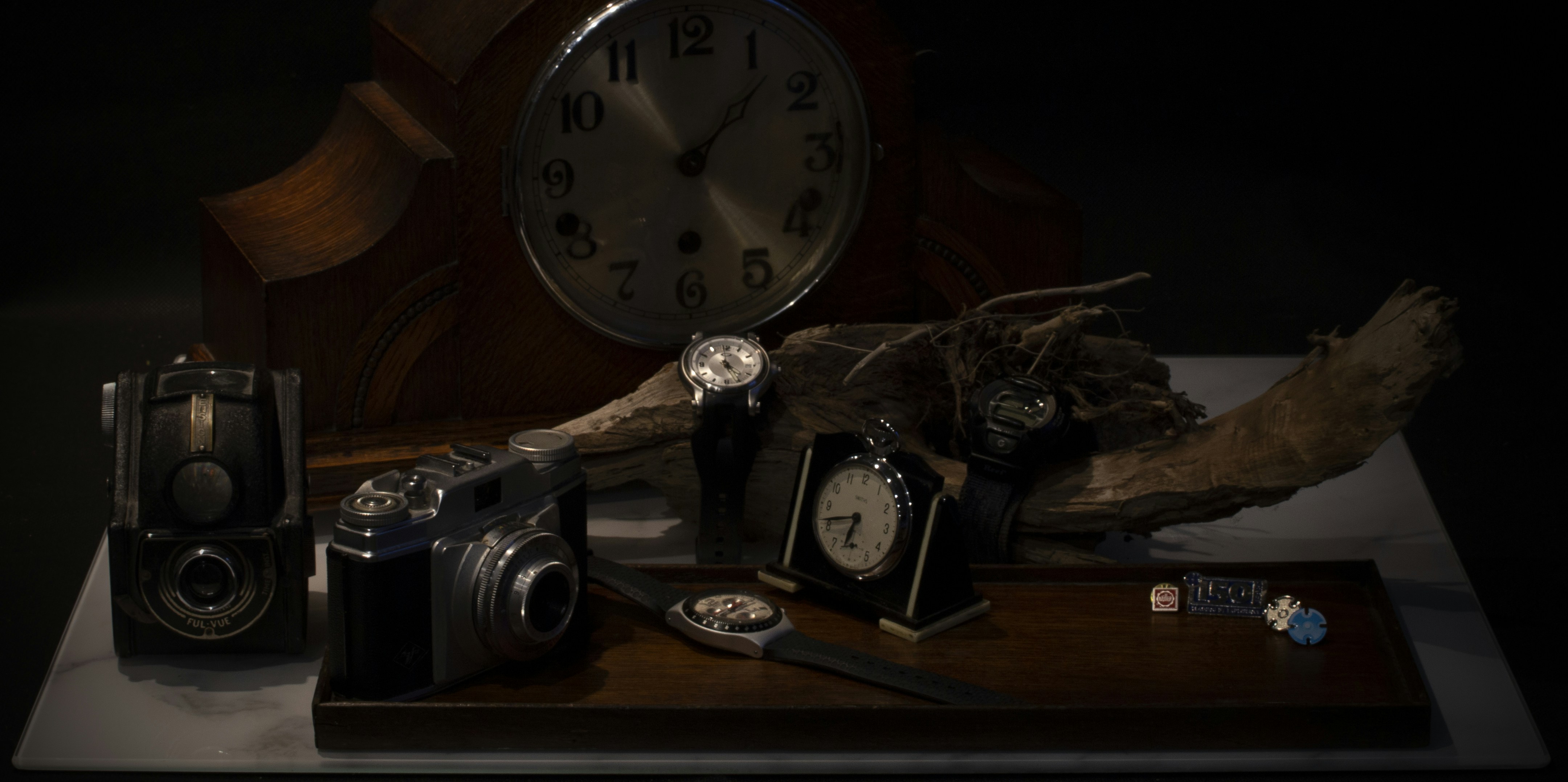 black and silver analog alarm clock