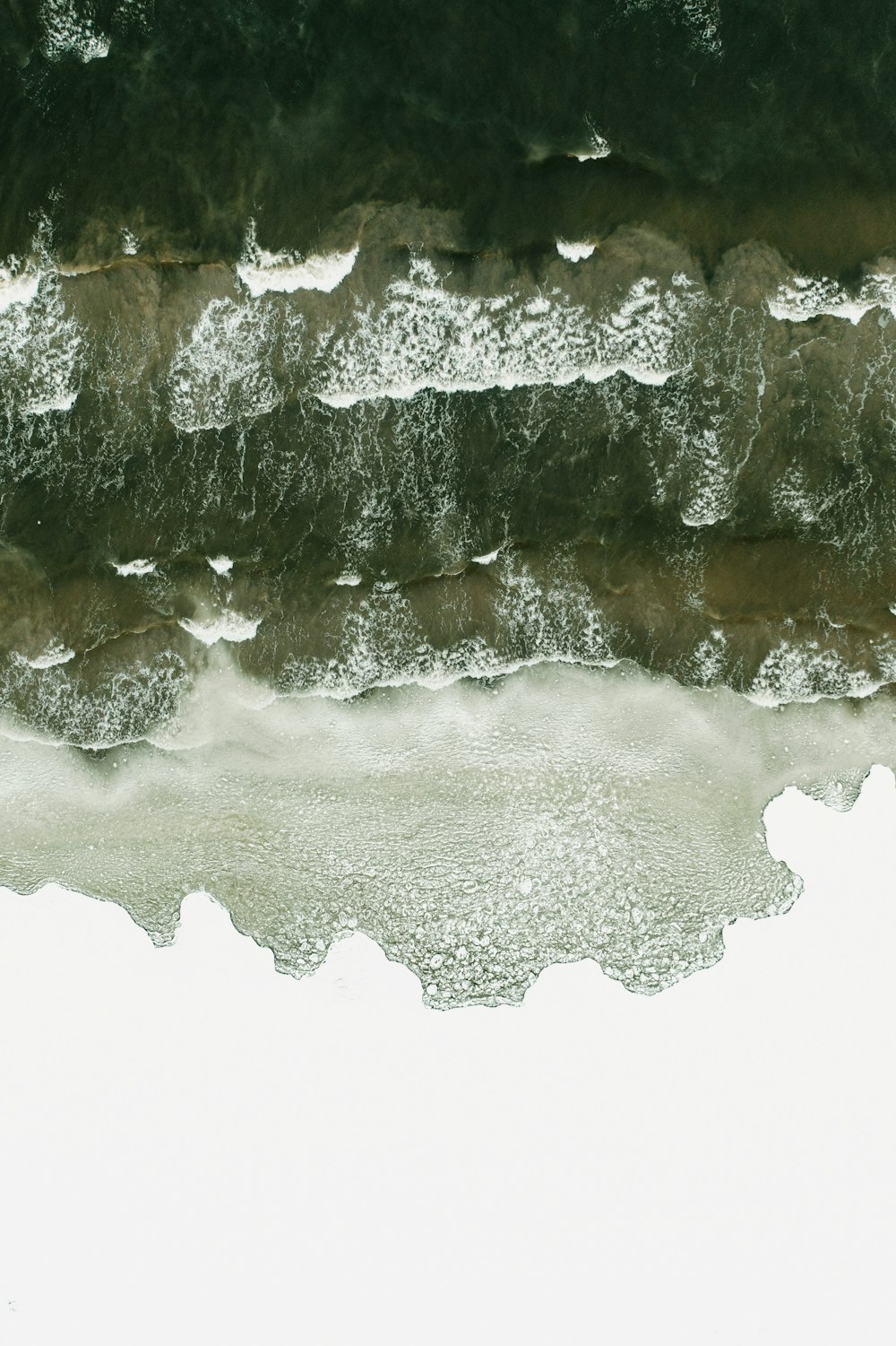 water waves hitting rocks during daytime