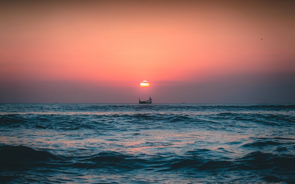 body of water during sunset