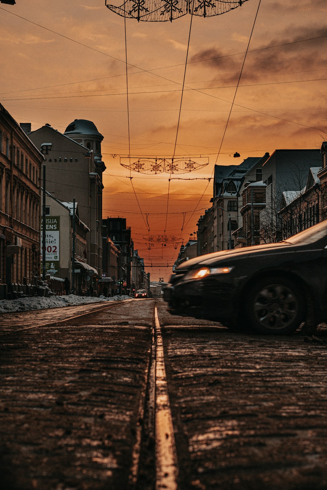 cars parked on side of the road during sunset