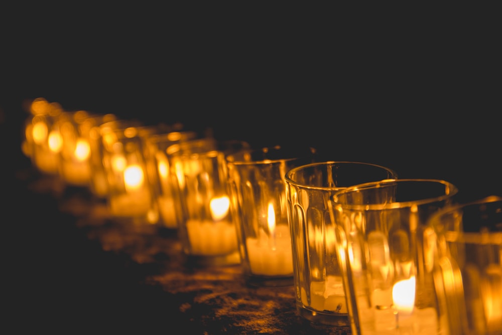 lighted candles on brown wooden table